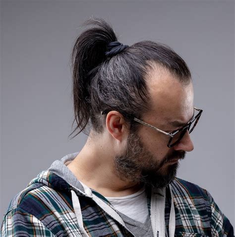 Ponytail haircut for mens - Discover the ponytail hairstyles for men such as undercut, fringe, man bun, permed, trimmed, skin fade, slicked, taper, and bob.